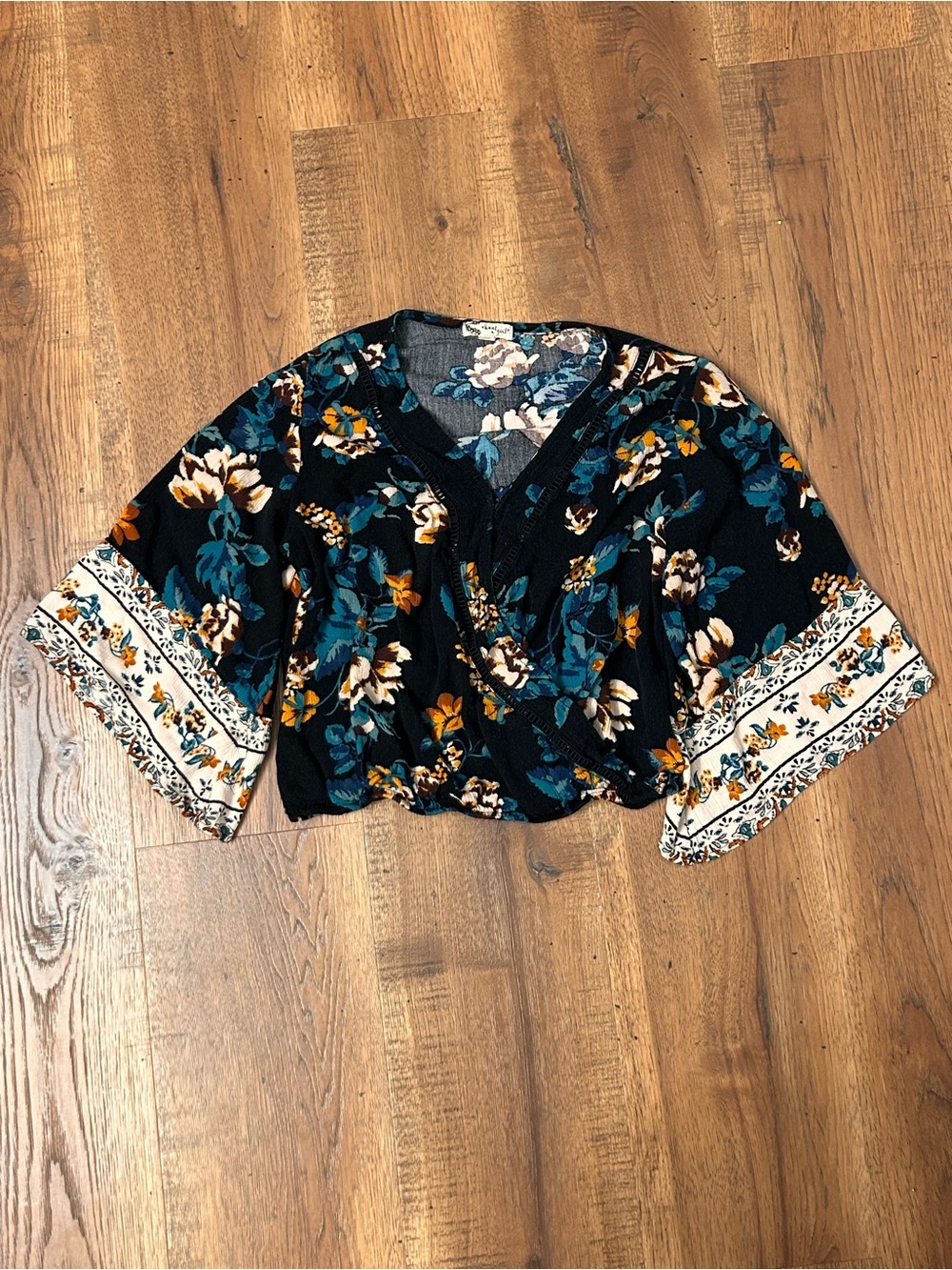 About A Girl Black Floral V-Neck Crop Blouse with Teal and Cream Accents